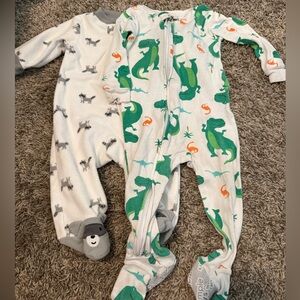 Set of 2 Carter's Footies pajamas - raccoon and dinosaur